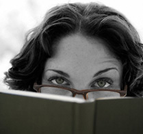 woman behind book